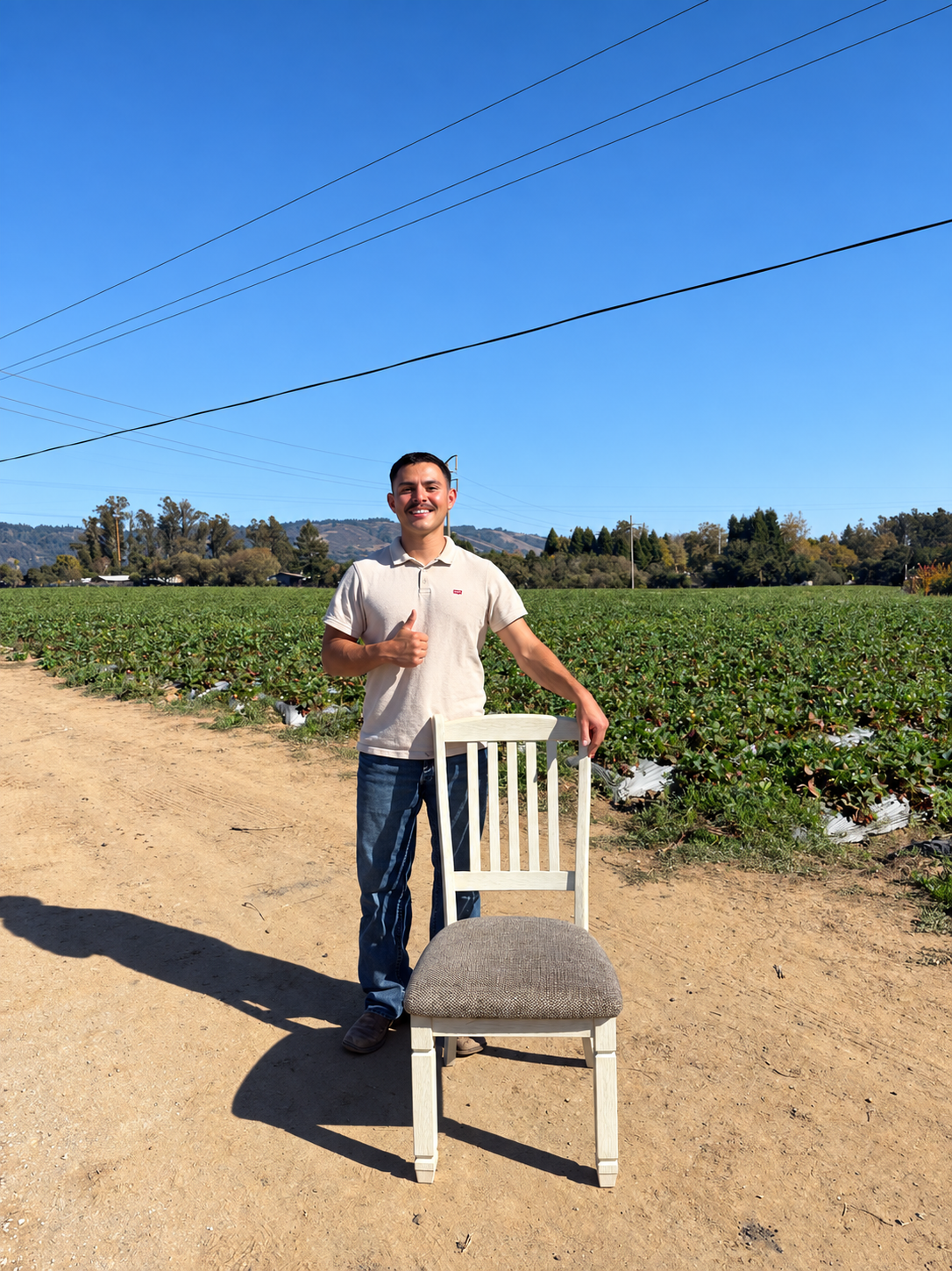 Oscar standing with a white dining chair outdoors